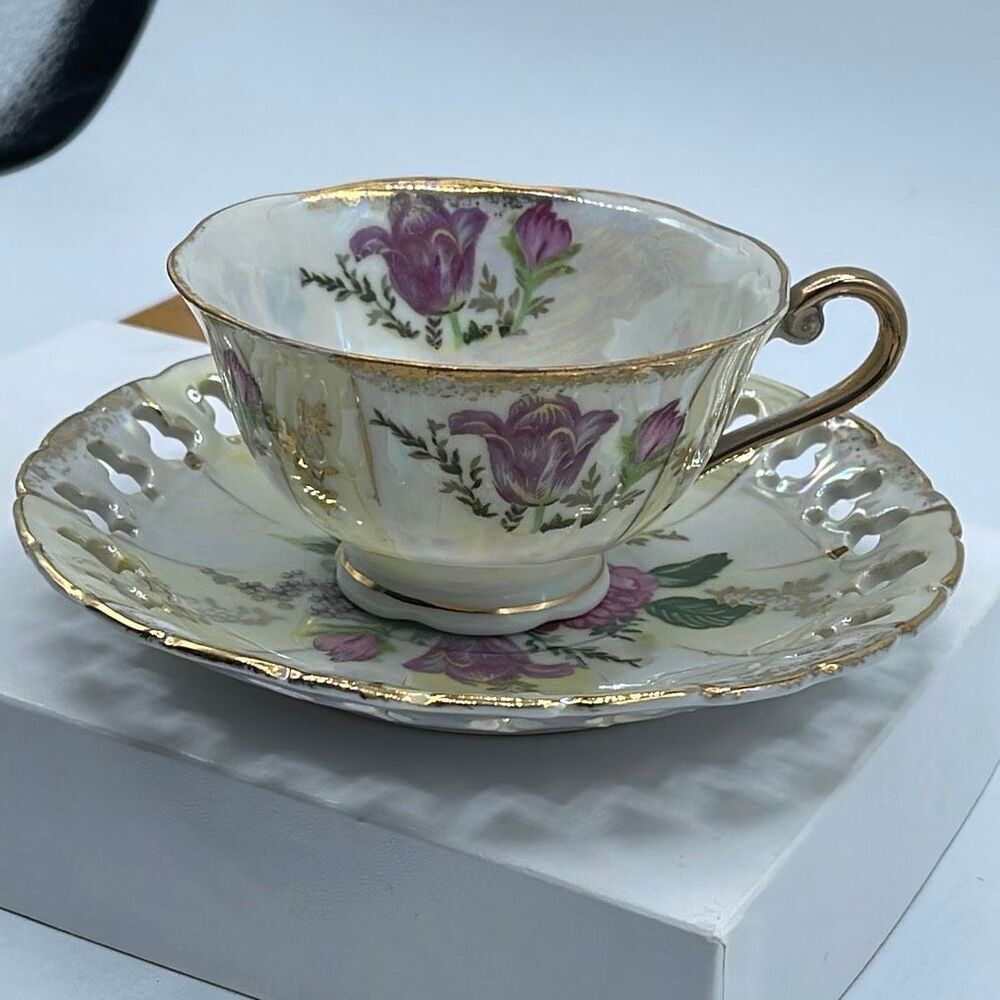 Vintage Japanese Lusterware teacup and saucer. Reticulated saucer.